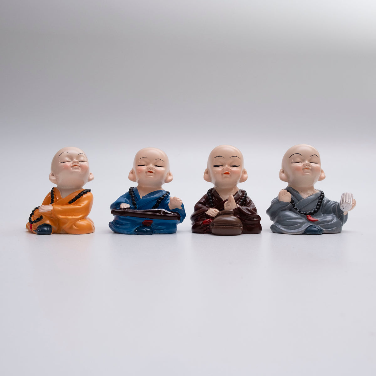 Set of 4 Buddha Monk Figurines – Adorable Resin Miniatures for Home & Car Décor